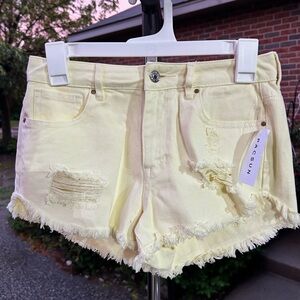 "Lemon drop" light yellow PacSun ripped Jean shorts.